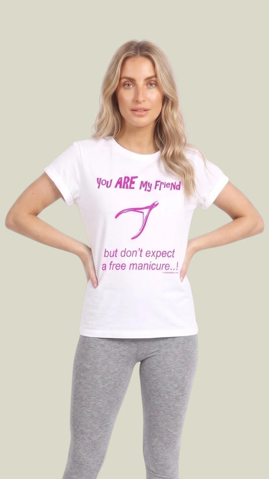 Front view of a blonde woman with hands on her hips modeling a white short-sleeve cotton t-shirt printed with pink text reading "You ARE My Friend but don't expect a free manicure...!" with a nail polish bottle graphic, paired with heather grey leggings against a solid light sage green background.